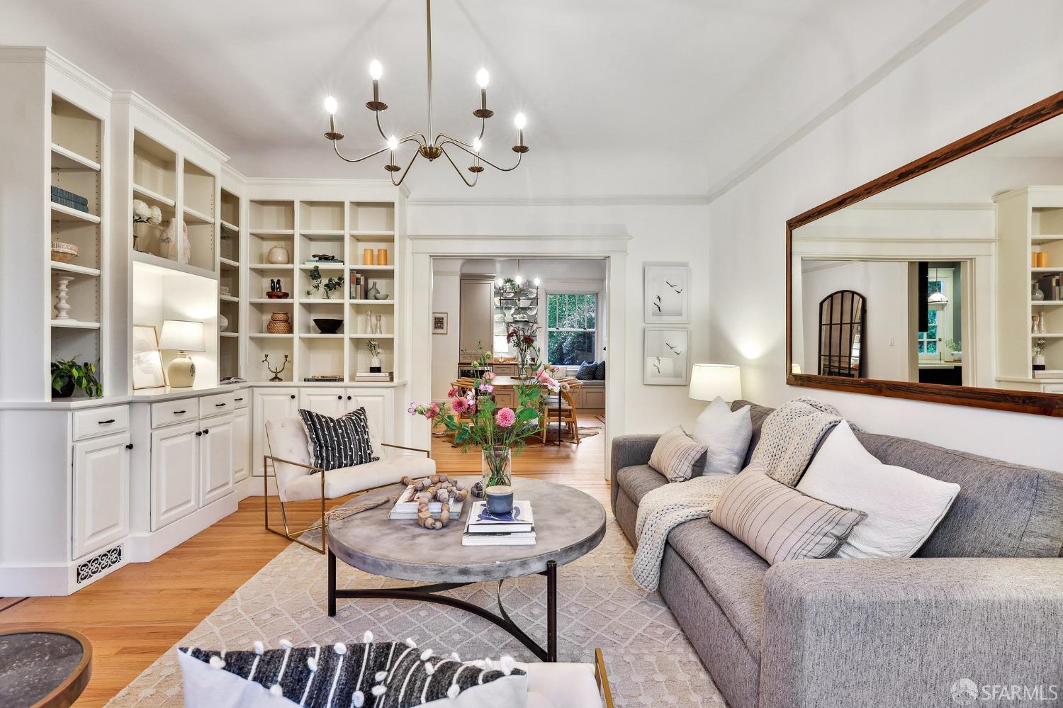 216 Ellsworth Street San Francisco, CA 94110 - Photo 6 of 76 a living room with furniture and a chandelier