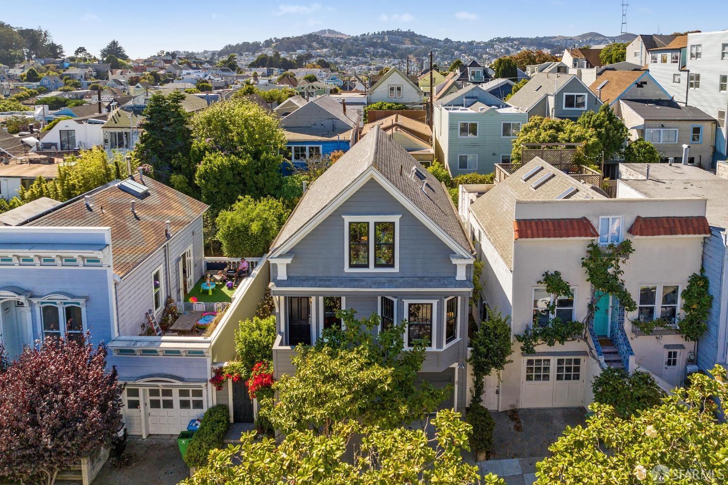 216 Ellsworth Street San Francisco, CA 94110 - Photo 62 of 76 a front view of a house with a yard