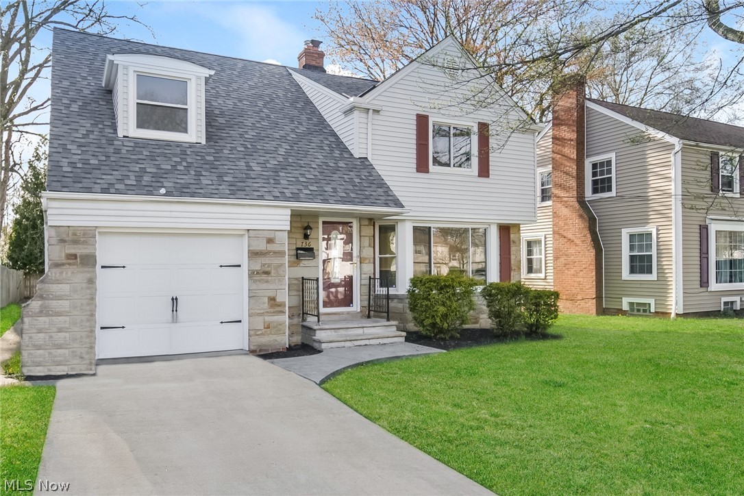 736 Quilliams Road Cleveland Heights, OH 44121 - Photo 2 of 20 View of front of house with a front lawn and a garage