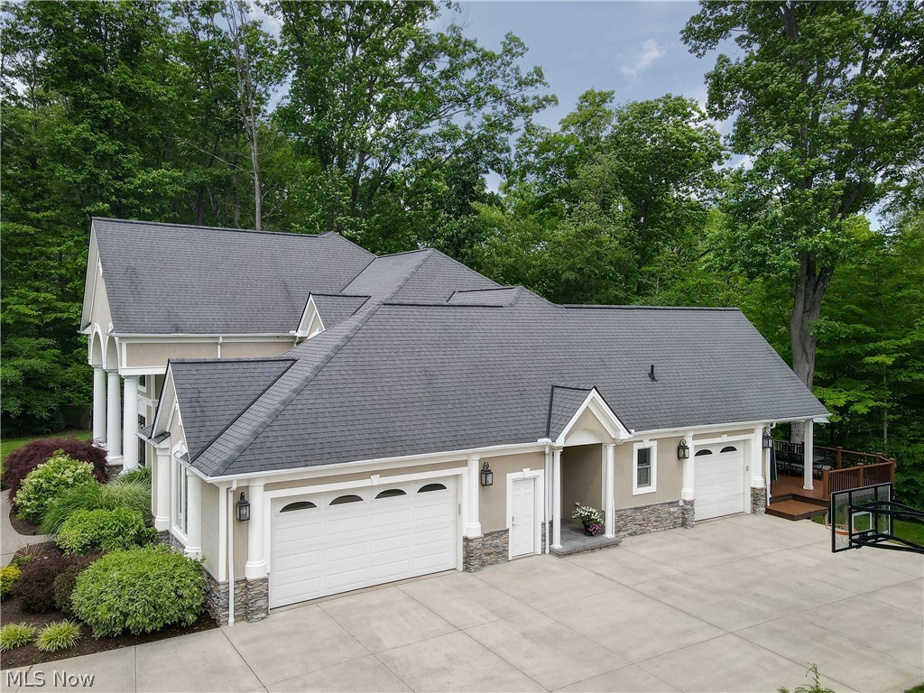 7070 Granite Ridge Chagrin Falls, OH 44023 - Photo 31 of 34 Three-car garage and concrete driveway