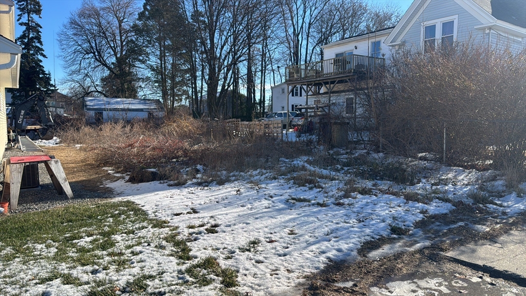 861 Main Street Clinton, MA 01510 - Photo 1 of 3 a backyard of a house with lots of green space