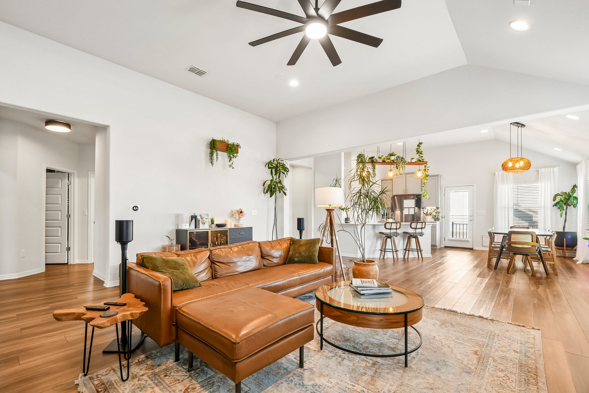 10700 Sentinel Drive Austin, TX 78747 - Photo 10 of 27 Open, easy, and connected from the couch to the kitchen to the dinner table.