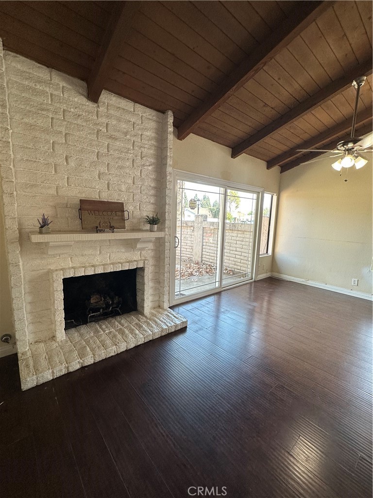 2516 North Tustin Avenue, Unit A Santa Ana, CA 92705 - Photo 4 of 5 a living room with wooden floors and a fireplace