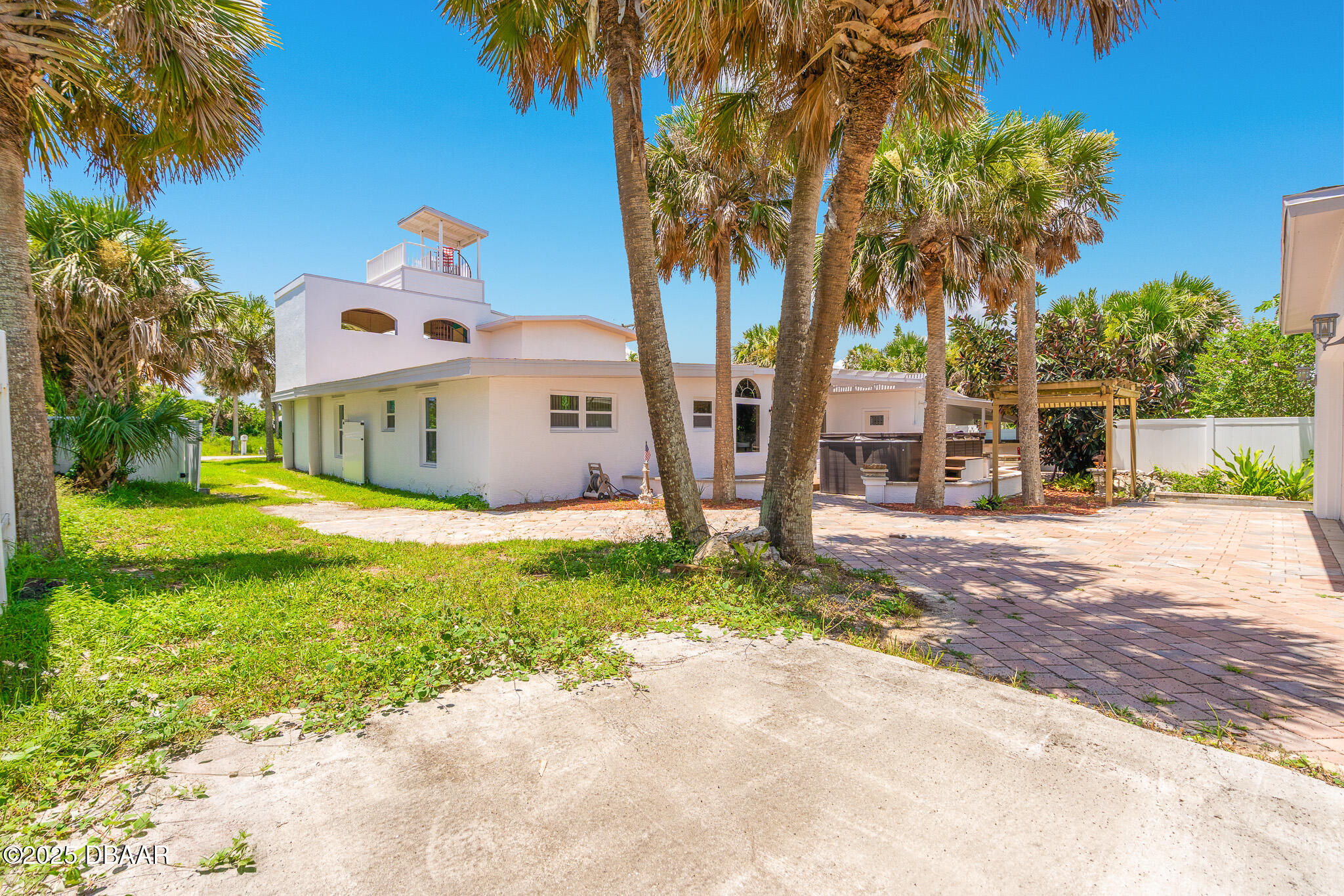 46 Oceanview Avenue Ponce Inlet, FL 32127 - Photo 54 of 79 a front view of a house with garden