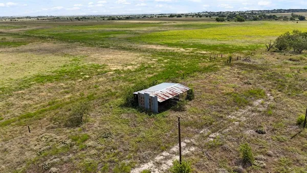 a view of a lake with houses in the back
