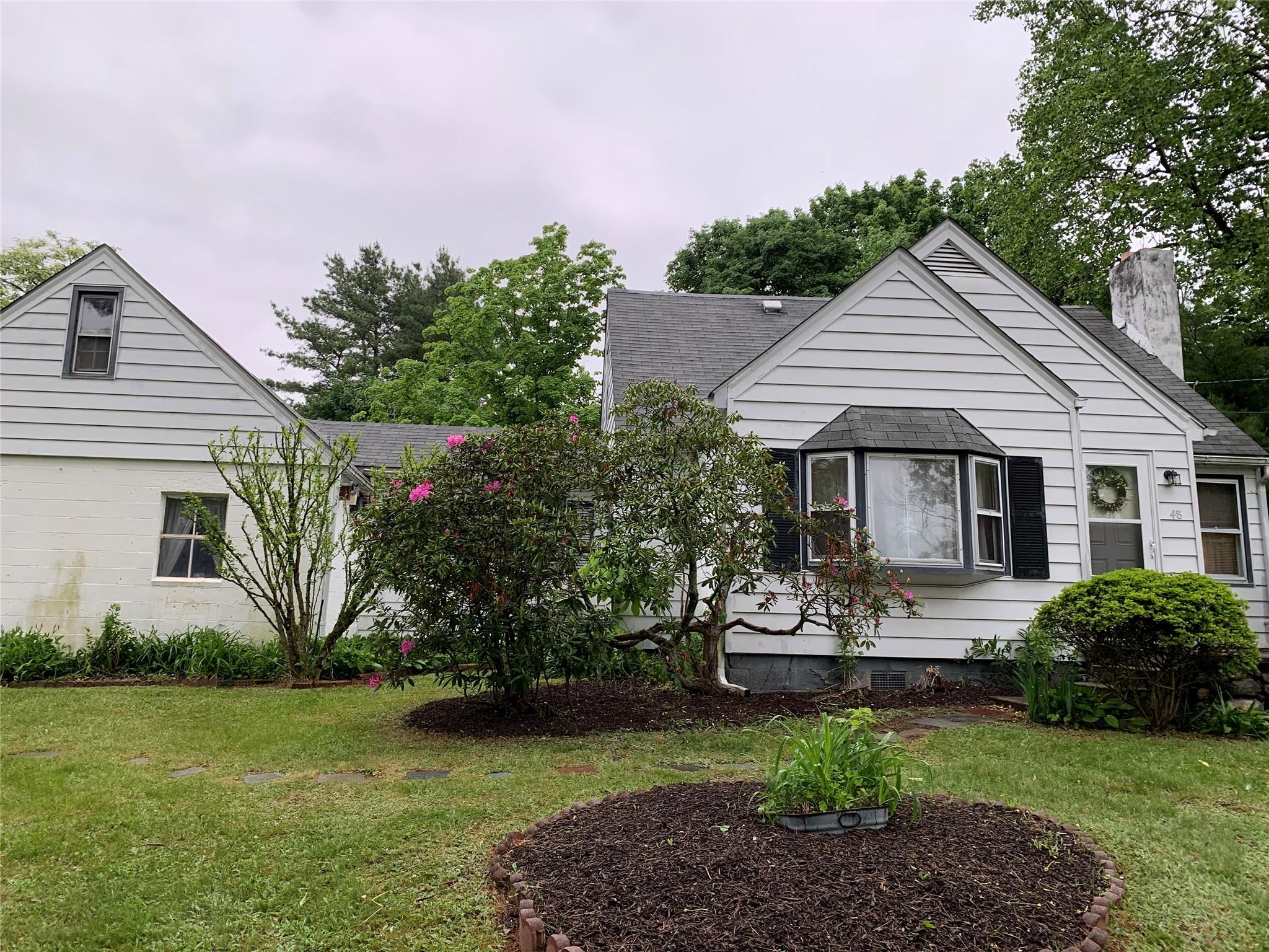 48 Sedgewick Road Poughkeepsie, NY 12603 - Photo 1 of 1 View of front facade with a shingled roof, a chimney, and a front lawn