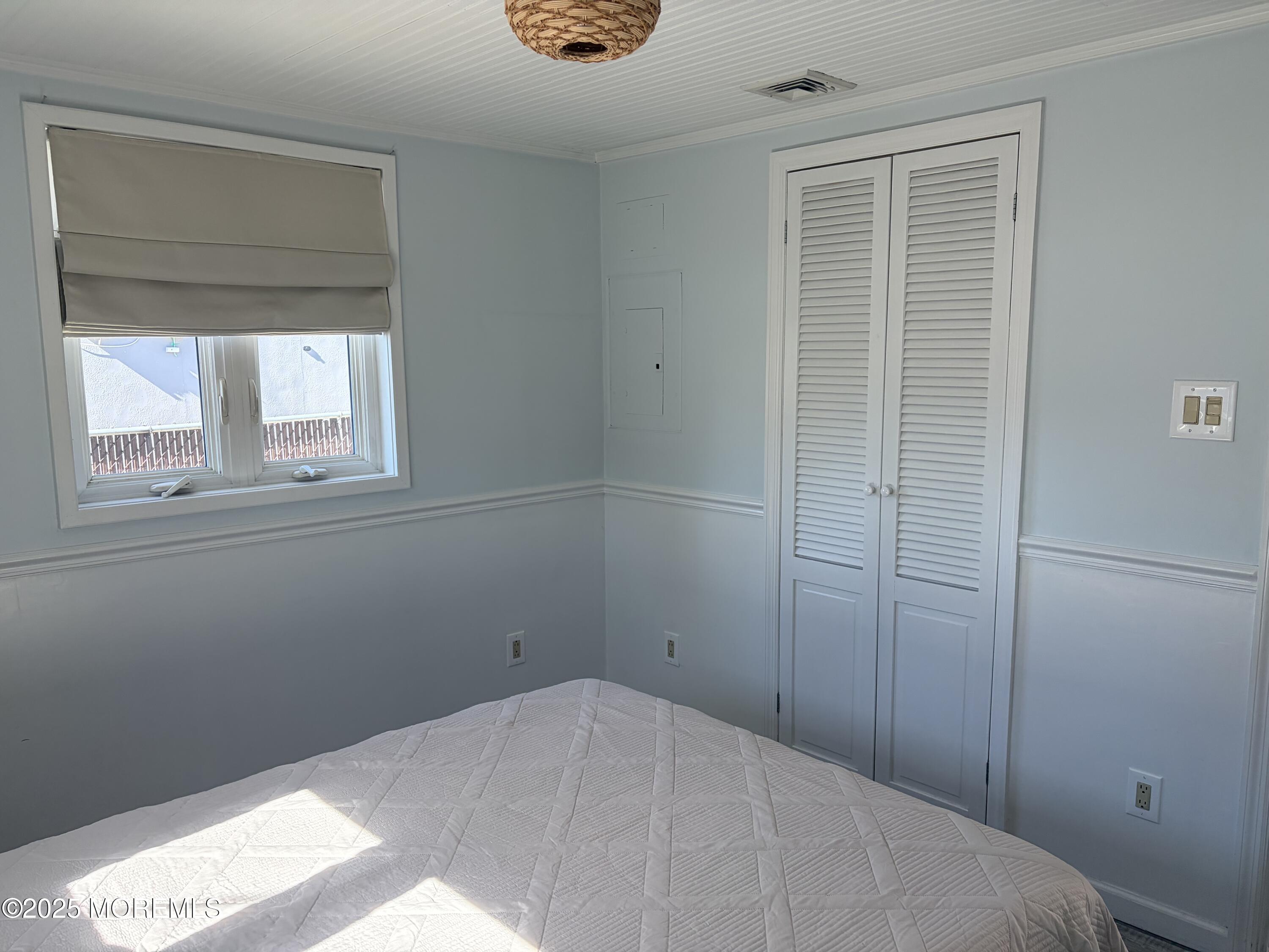 237 Butler Boulevard Bayville, NJ 08721 - Photo 12 of 25 a bedroom with a bed and a window