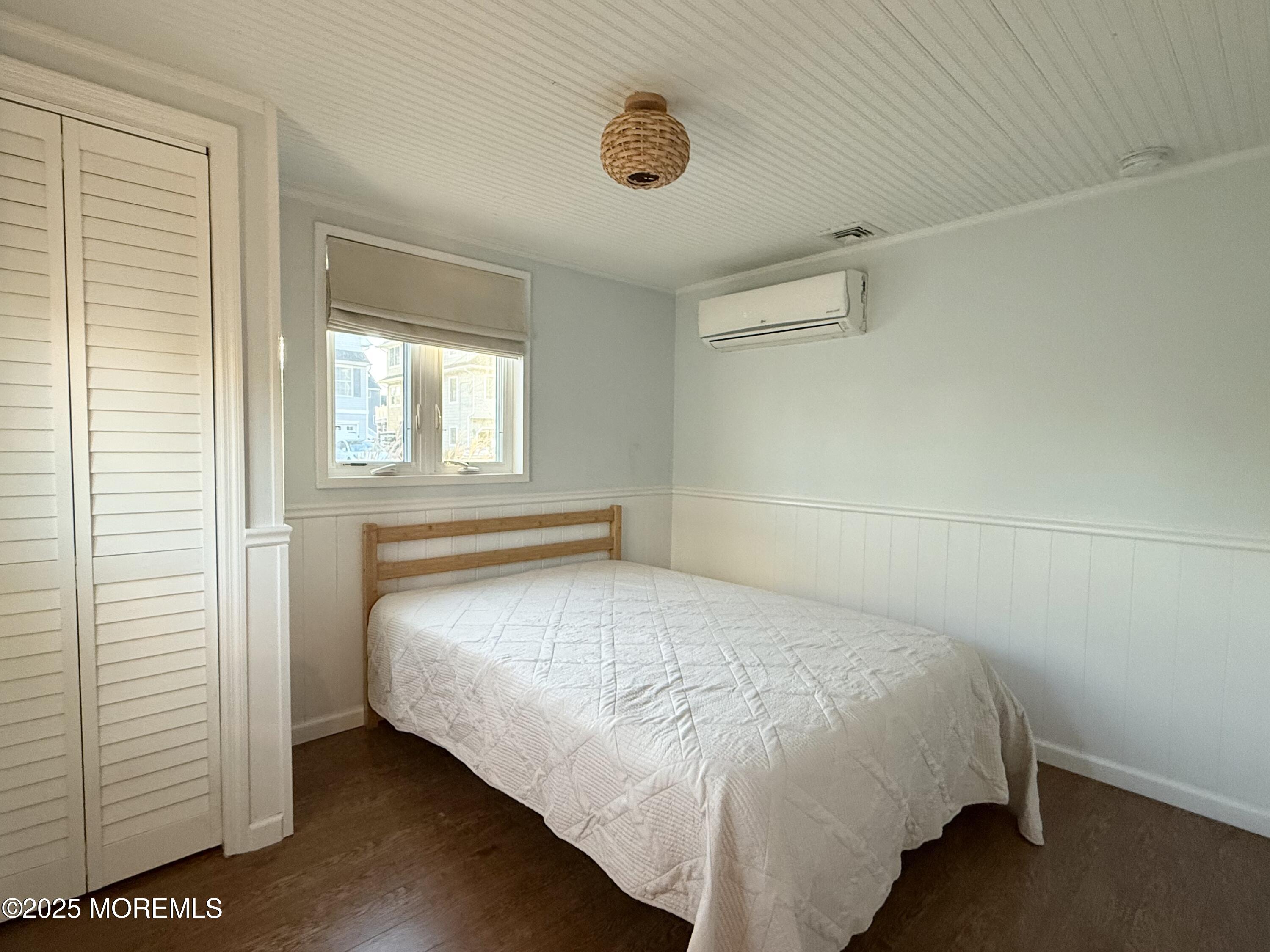 237 Butler Boulevard Bayville, NJ 08721 - Photo 13 of 25 a bedroom with a bed and window