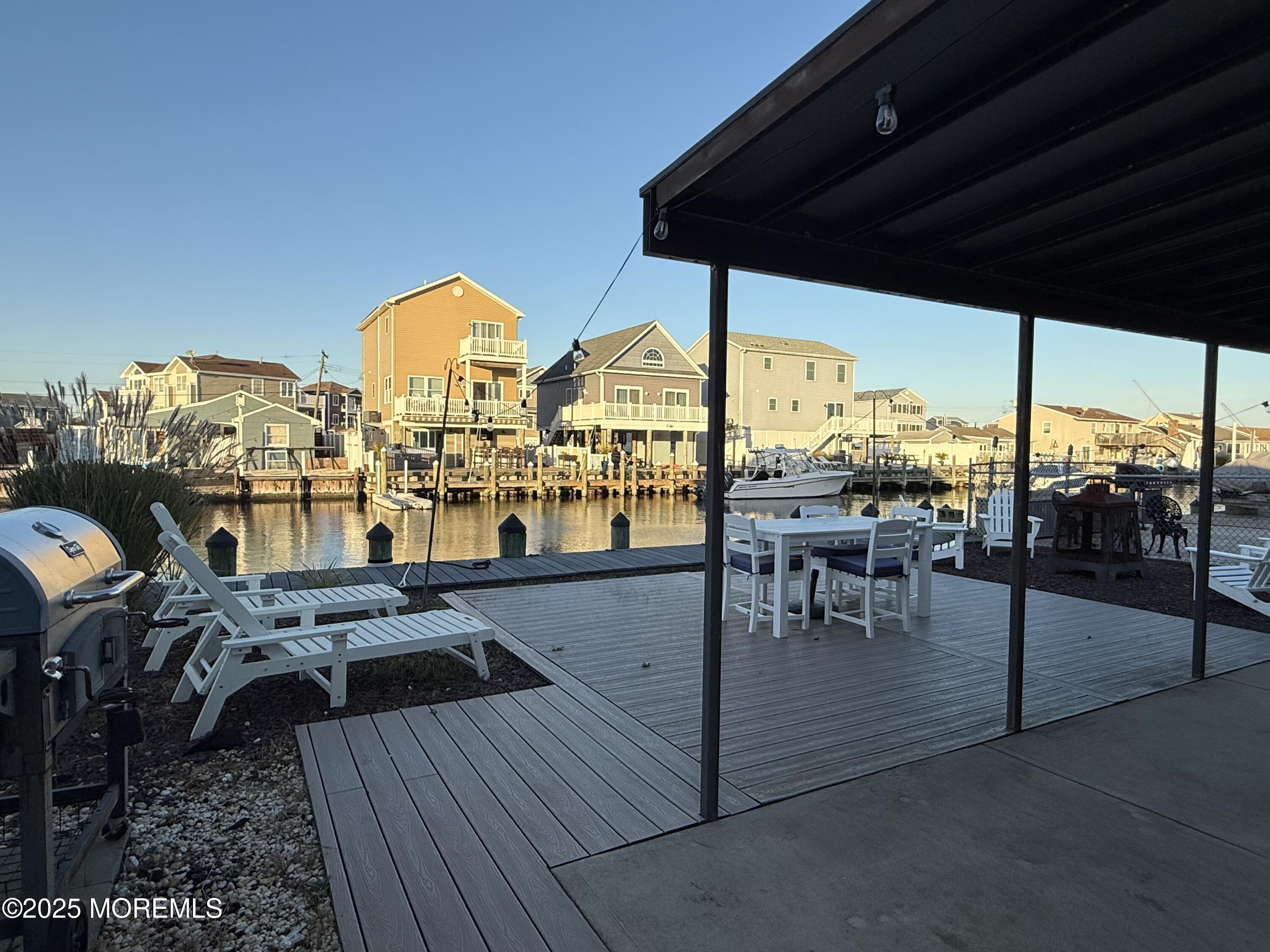237 Butler Boulevard Bayville, NJ 08721 - Photo 16 of 25 a view of a swimming pool and outdoor seating