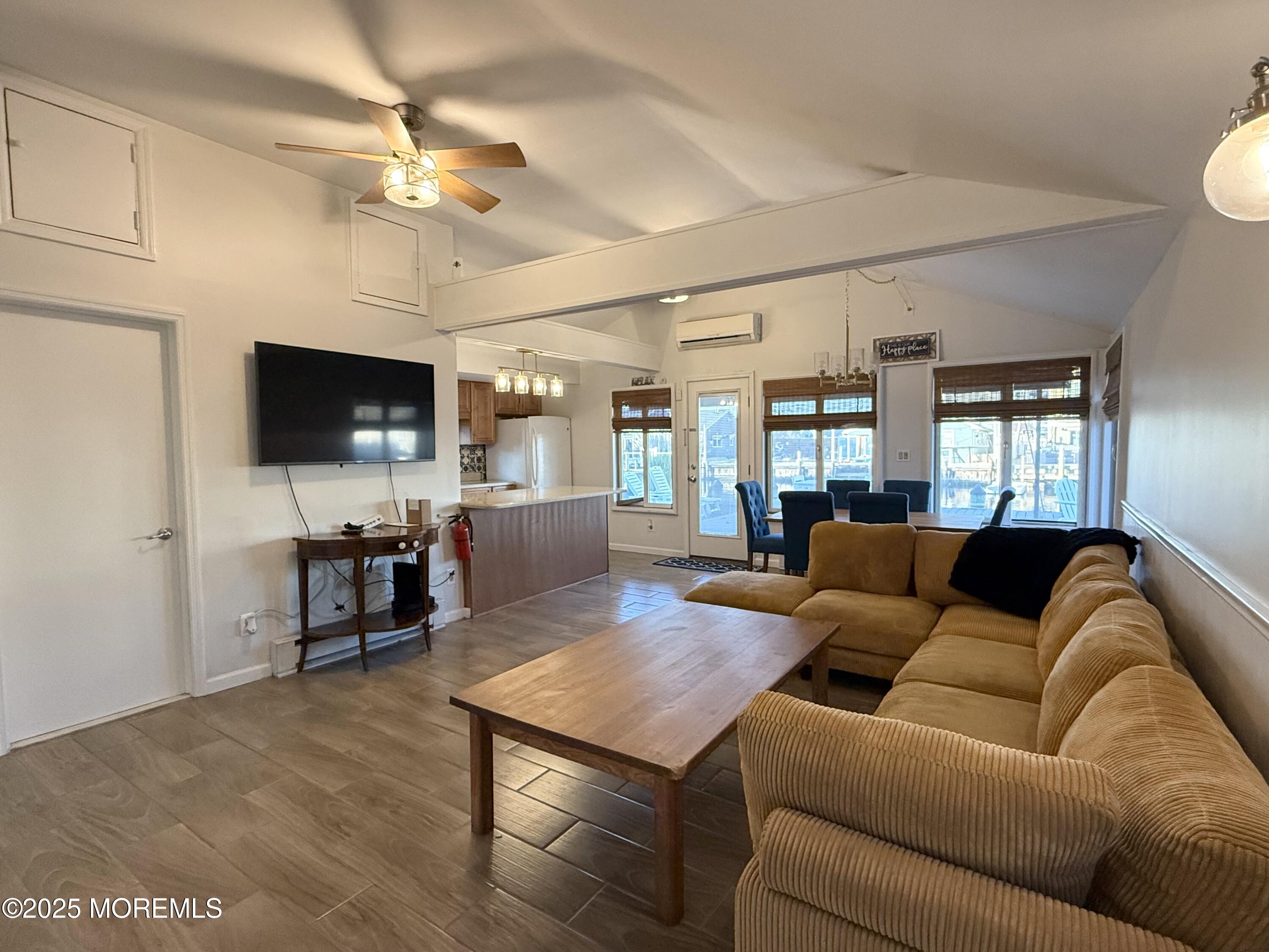 237 Butler Boulevard Bayville, NJ 08721 - Photo 4 of 25 a living room with furniture and a flat screen tv