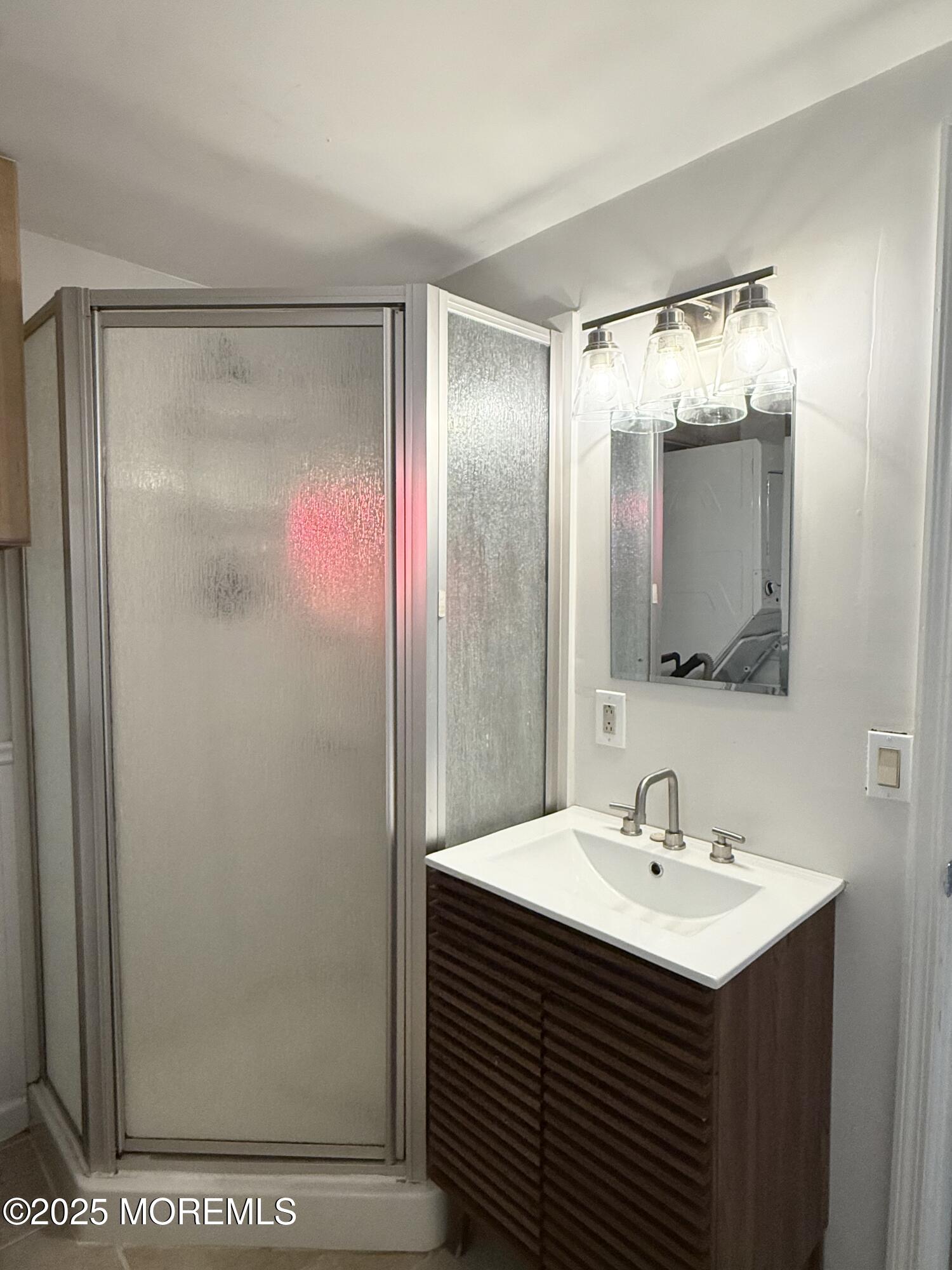 237 Butler Boulevard Bayville, NJ 08721 - Photo 10 of 25 a bathroom with a sink and mirror