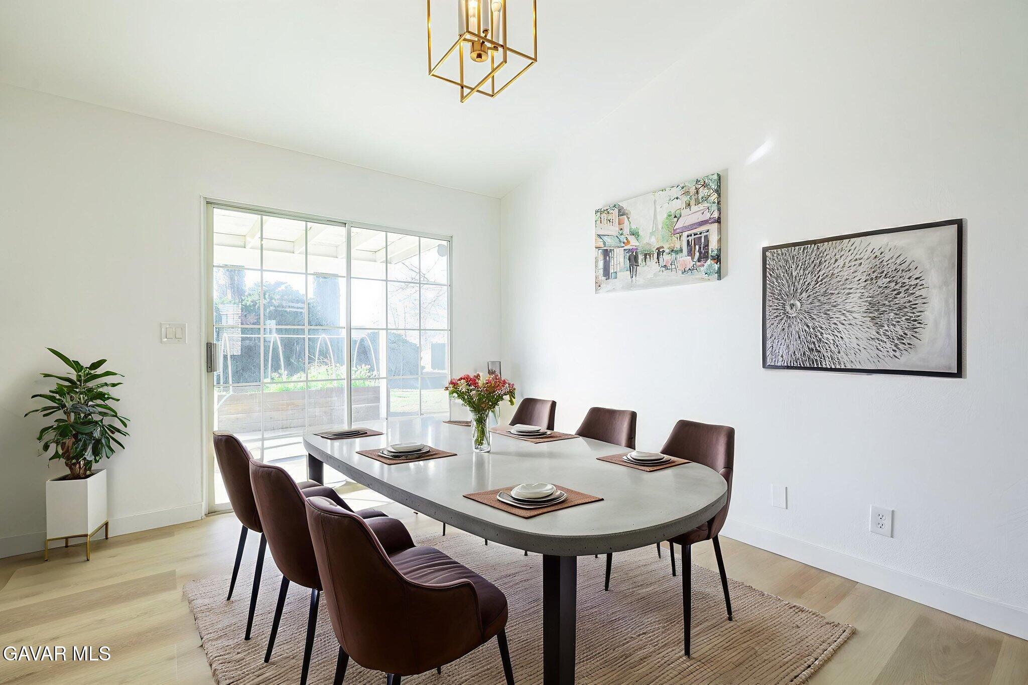 7930 Elder Avenue Rosamond, CA 93560 - Photo 11 of 35 a view of a dining room with furniture window and wooden floor