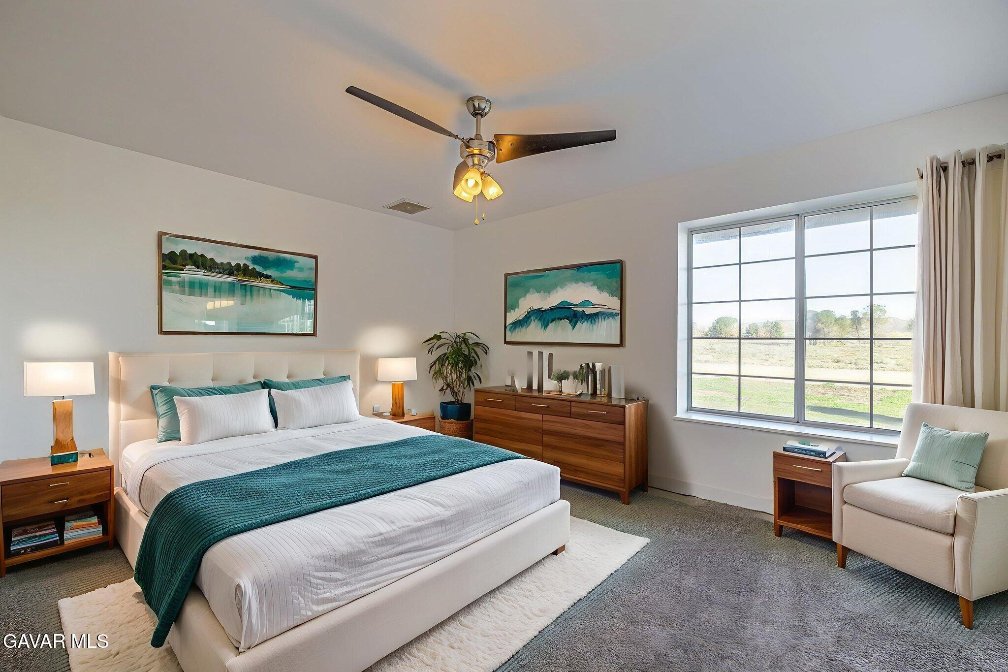 7930 Elder Avenue Rosamond, CA 93560 - Photo 2 of 35 a bedroom with a bed couch and a window