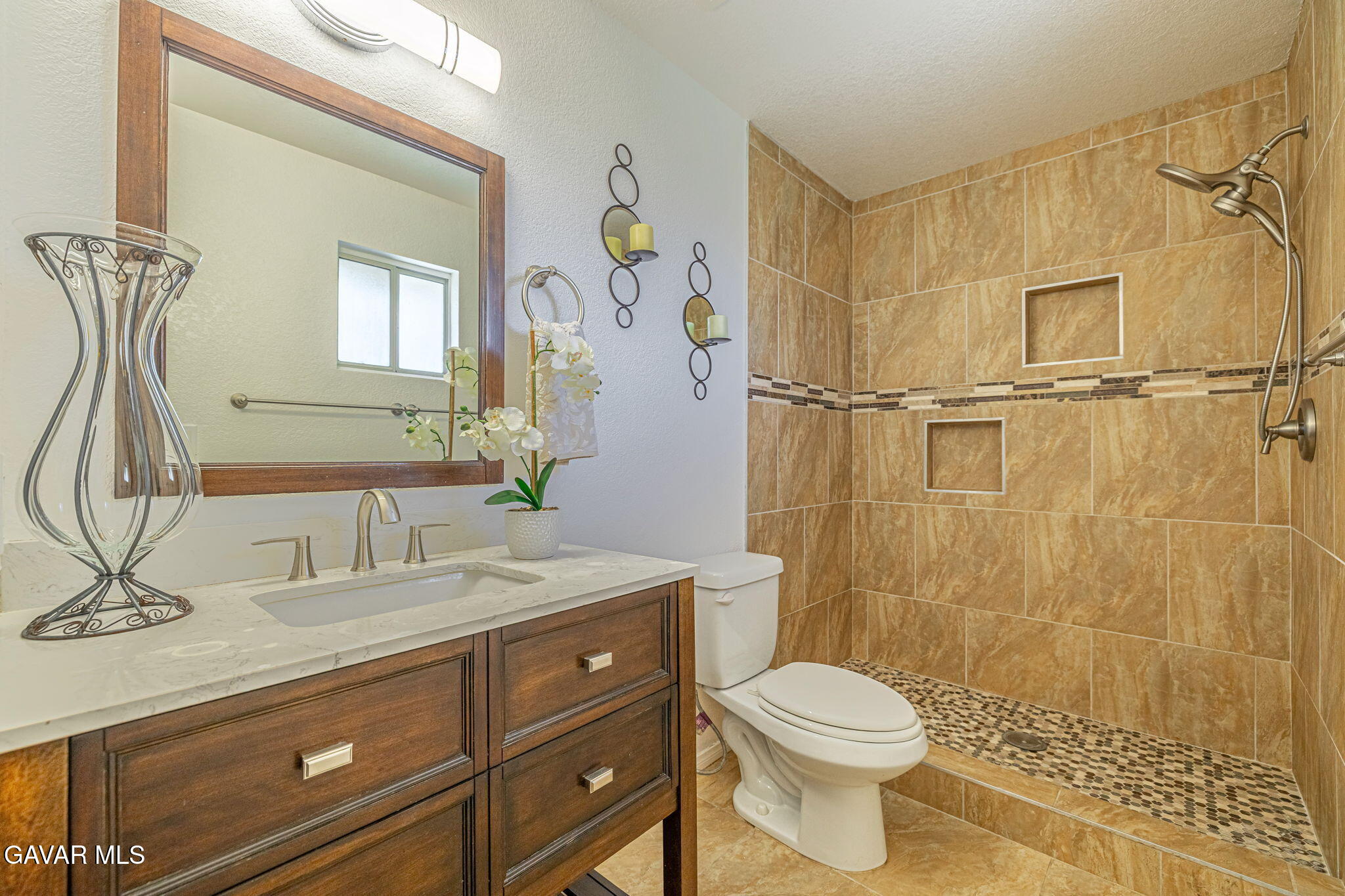 7930 Elder Avenue Rosamond, CA 93560 - Photo 21 of 35 a bathroom with a sink a toilet and shower