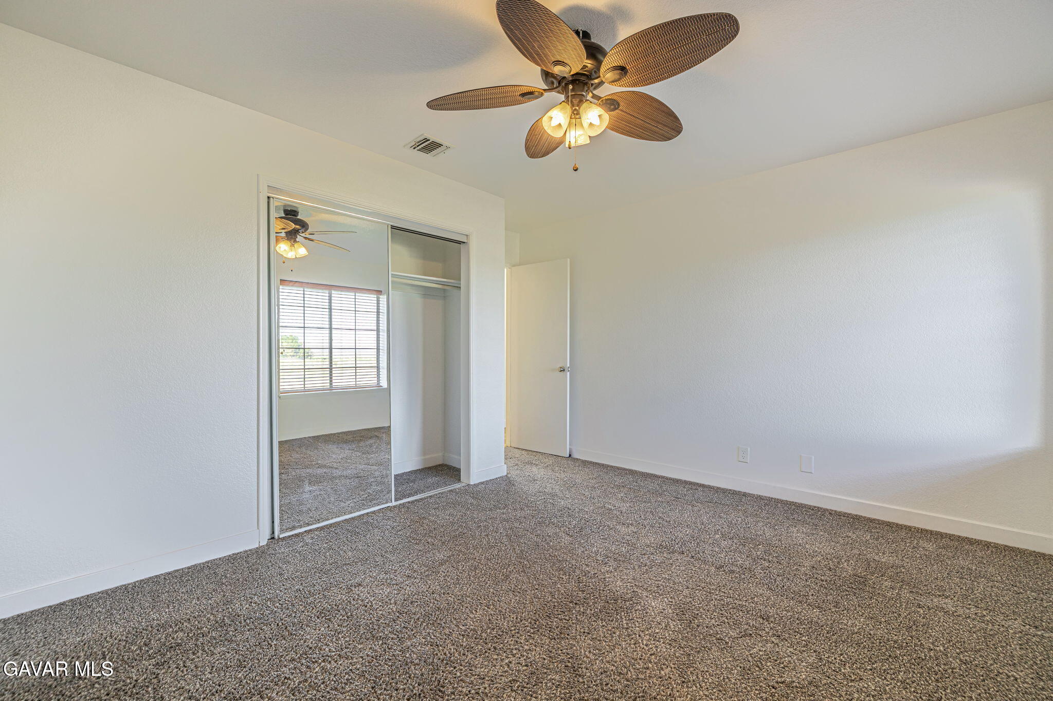 7930 Elder Avenue Rosamond, CA 93560 - Photo 24 of 35 an empty room with closet and windows