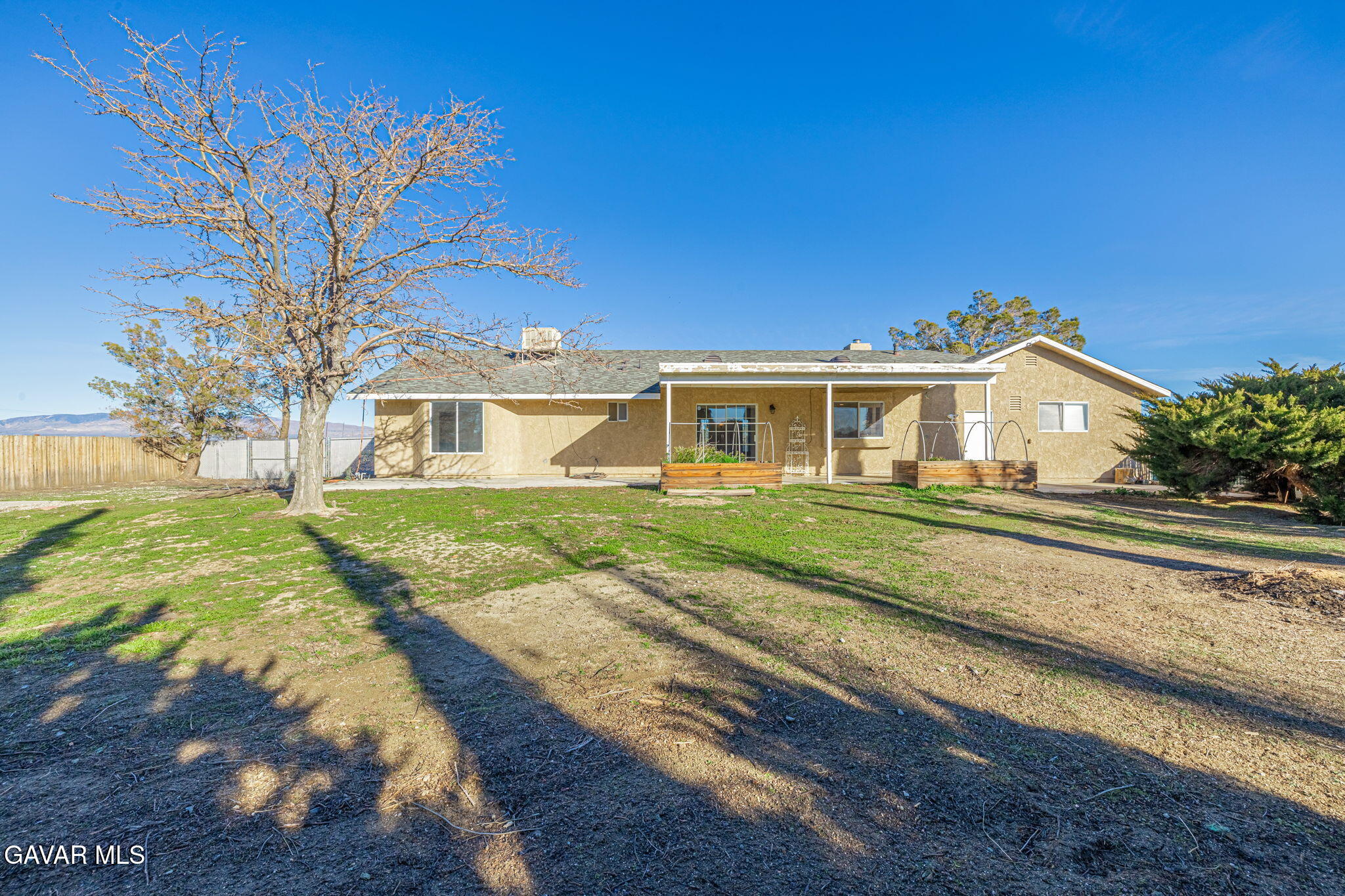 7930 Elder Avenue Rosamond, CA 93560 - Photo 30 of 35 a view of house with a big yard