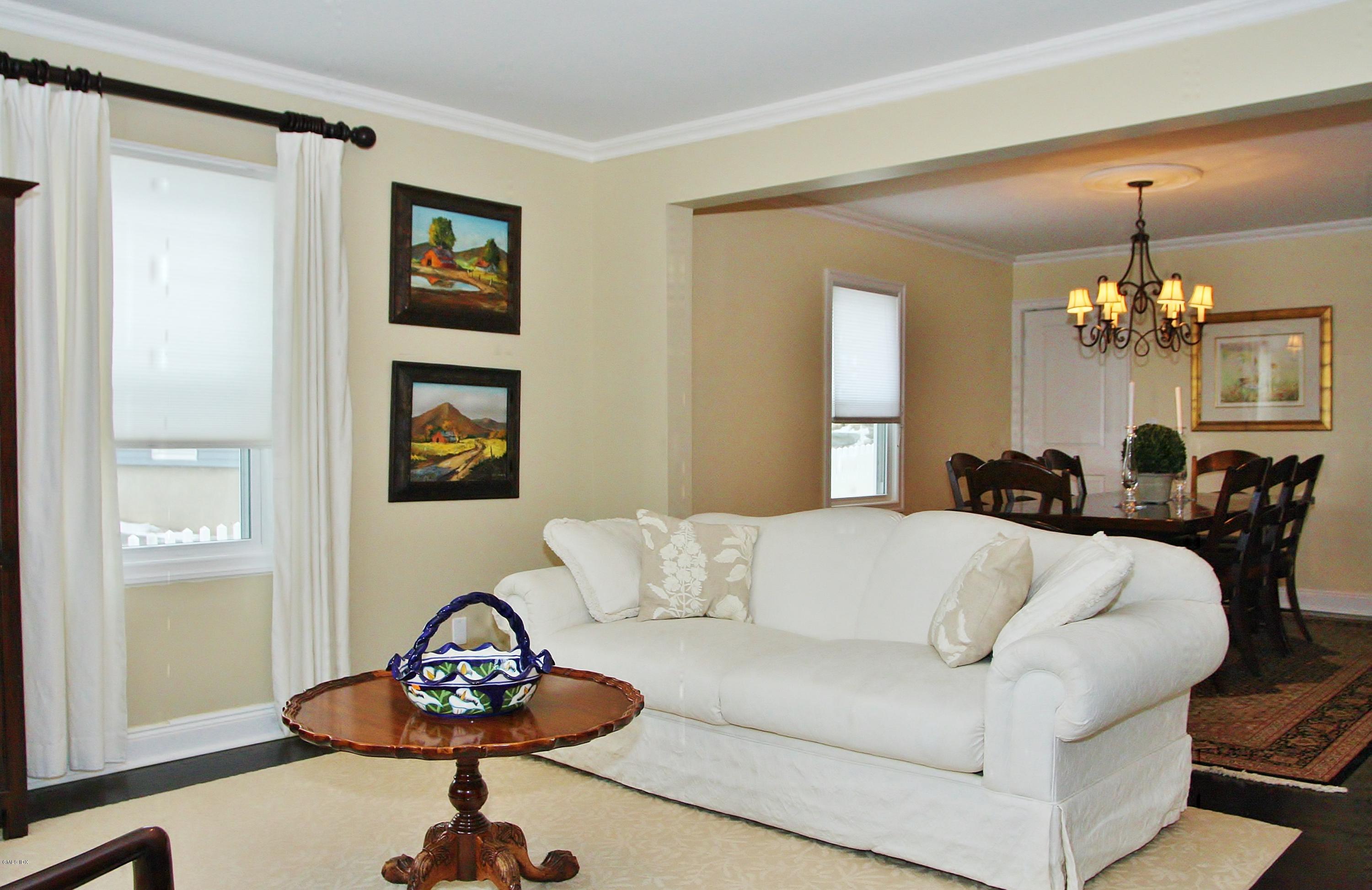 27 Thorn Hill Road Riverside, CT 06878 - Photo 6 of 27 a living room with furniture and a chandelier