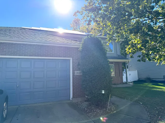 a view of a house with a tree