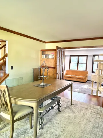 a room with furniture pool table and windows