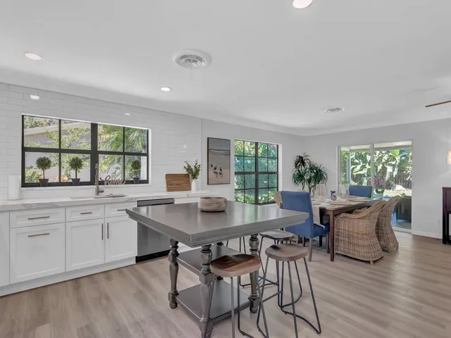 a dining room with furniture window wooden floor