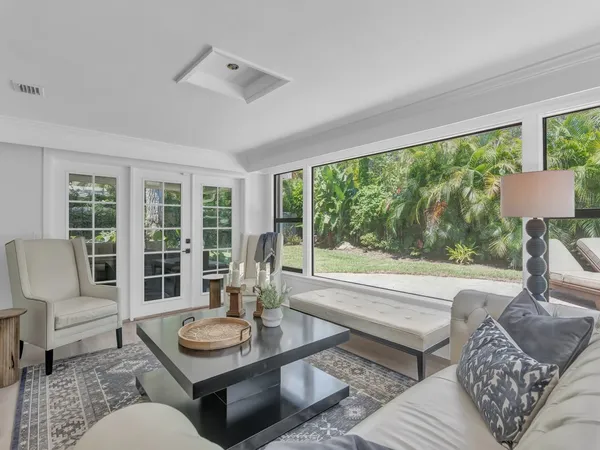 a living room with furniture and a large window