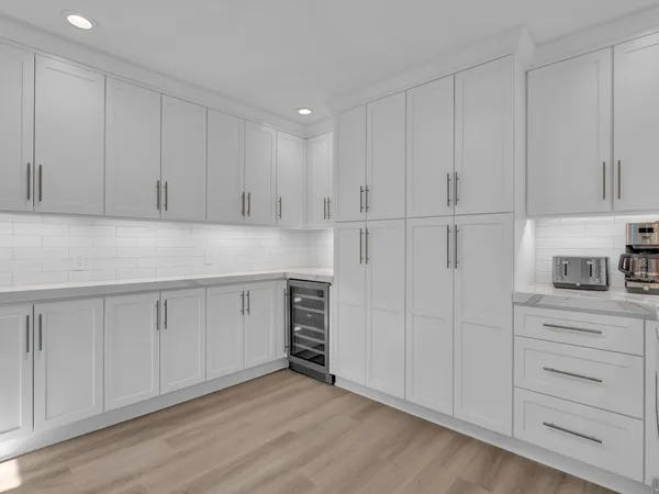 a bedroom with a bed a couch and a window