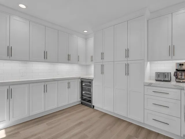 a bedroom with a bed a couch and a window