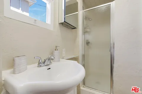 a view of a patio with chairs and a table