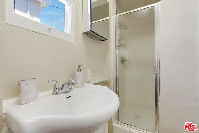 a view of a patio with chairs and a table