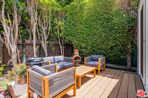 a view of a backyard with sitting area