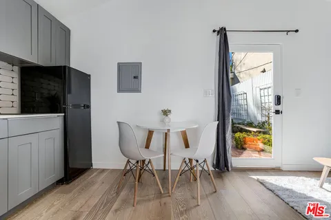 a utility room with sink dryer and washer