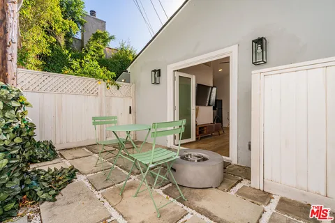 a view of a house with a backyard and garden