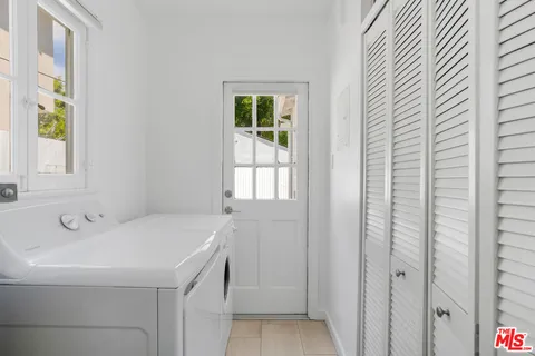 a bathroom with a sink and a window