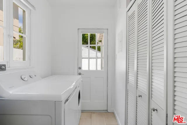 a bathroom with a sink and a window