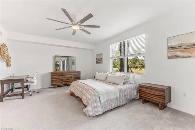 a bedroom with a bed furniture and a window
