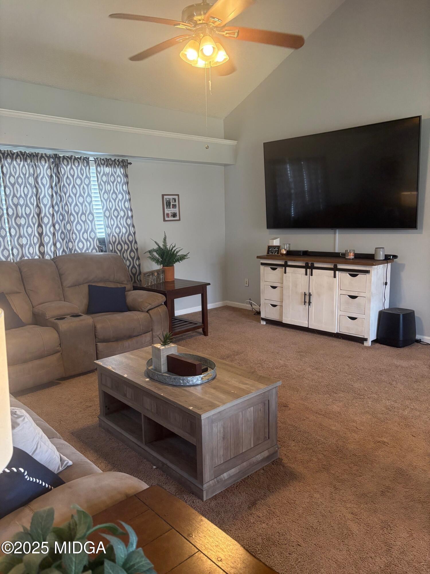 132 Old Hickory Road Byron, GA 31008 - Photo 11 of 35 a living room with furniture and a flat screen tv