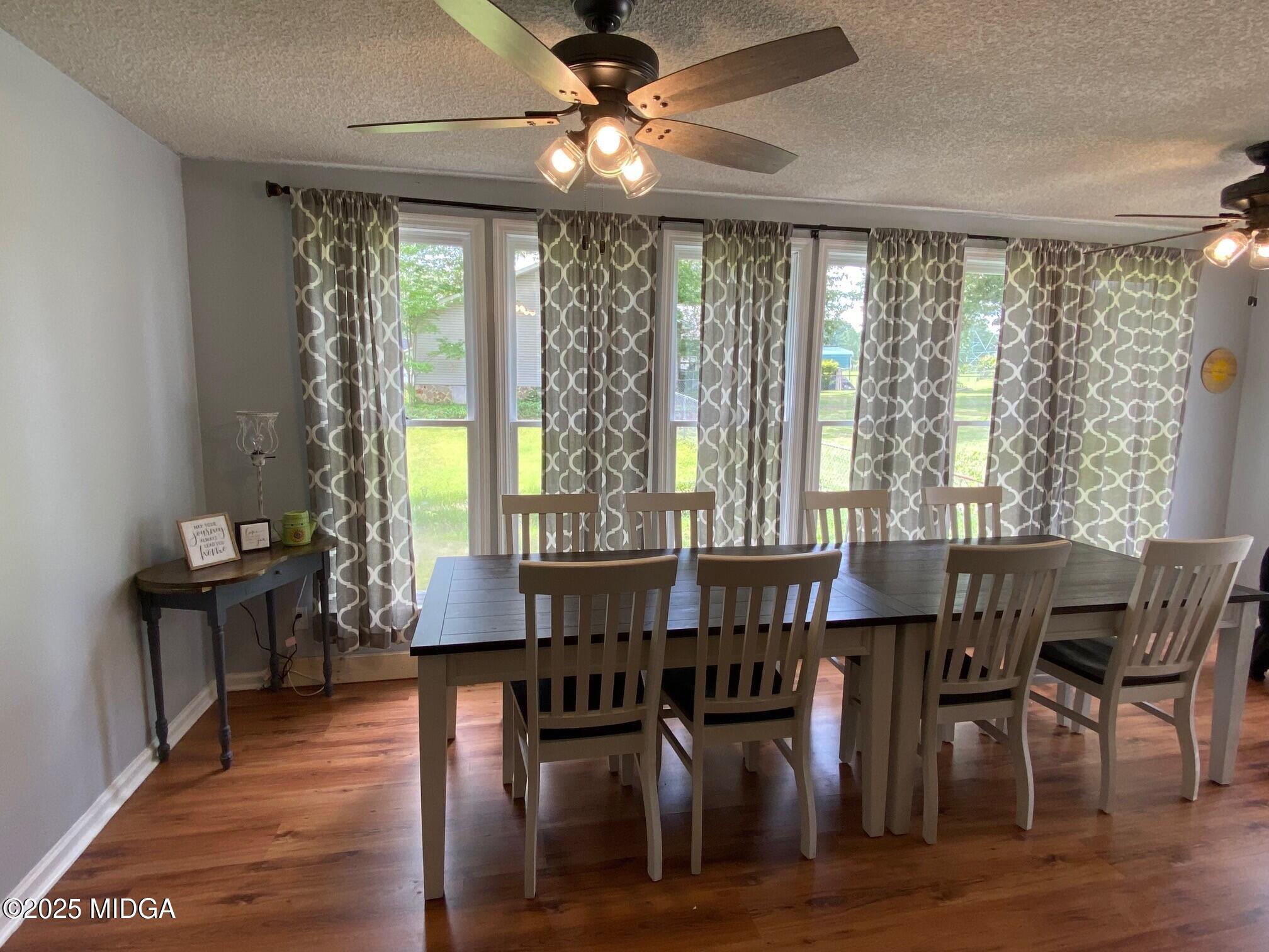 132 Old Hickory Road Byron, GA 31008 - Photo 12 of 35 a view of a a dining room with furniture window and wooden floor