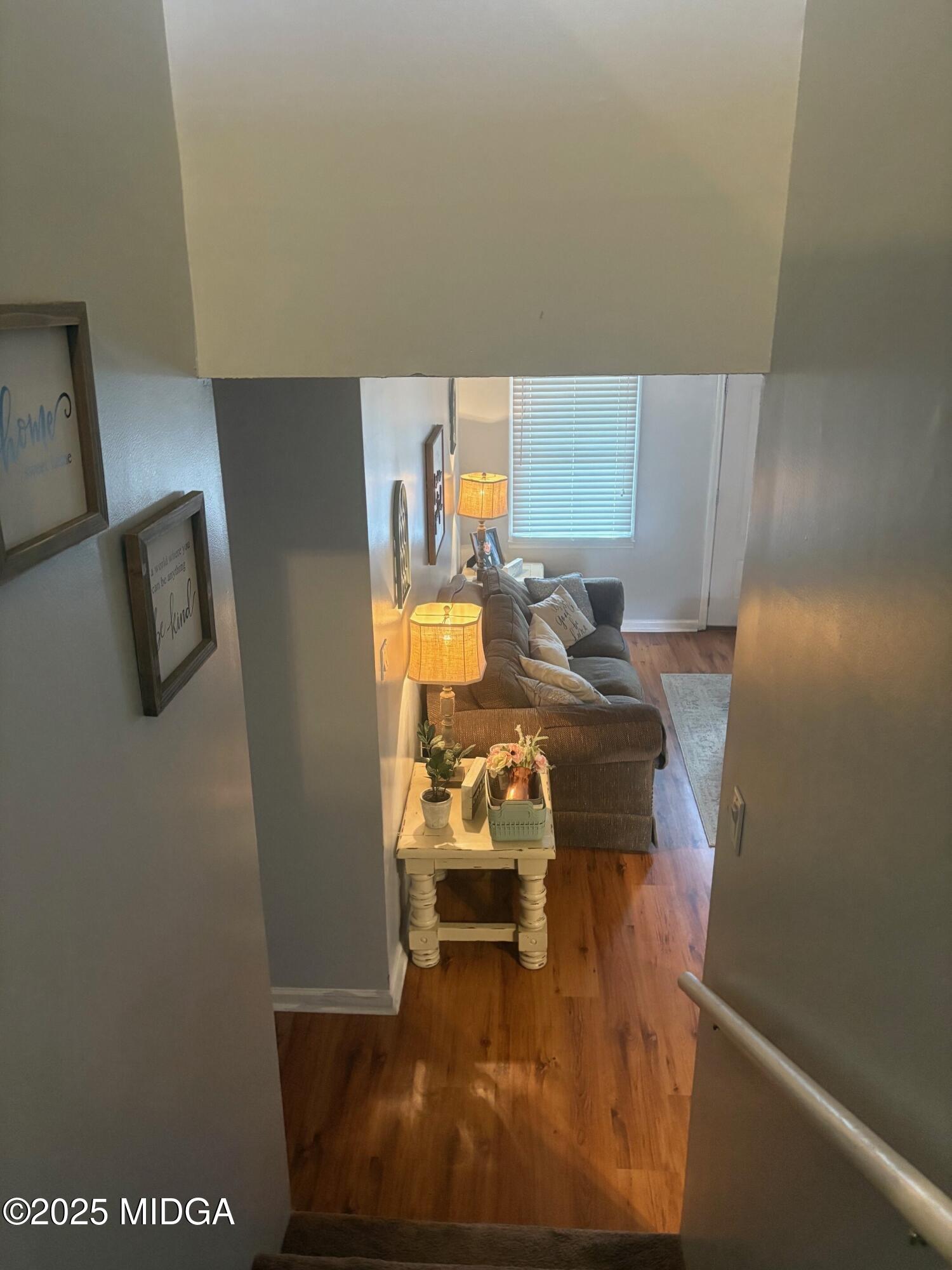 132 Old Hickory Road Byron, GA 31008 - Photo 17 of 35 a room with a chair and potted plant on the wall