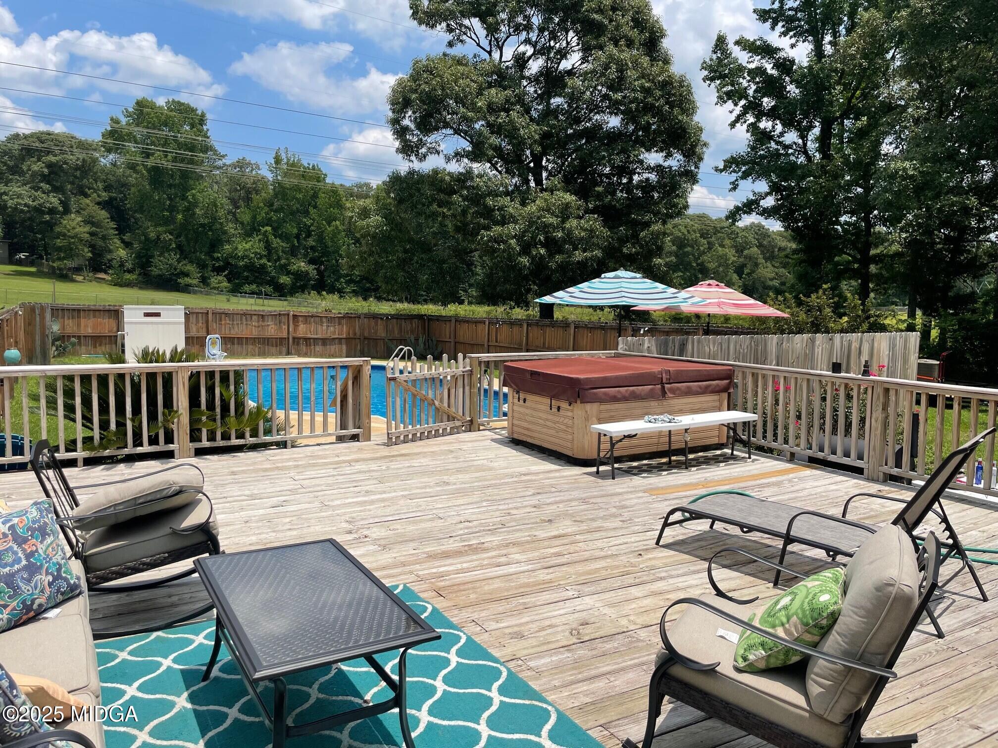 132 Old Hickory Road Byron, GA 31008 - Photo 24 of 35 a view of a patio with couches chairs and wooden floor