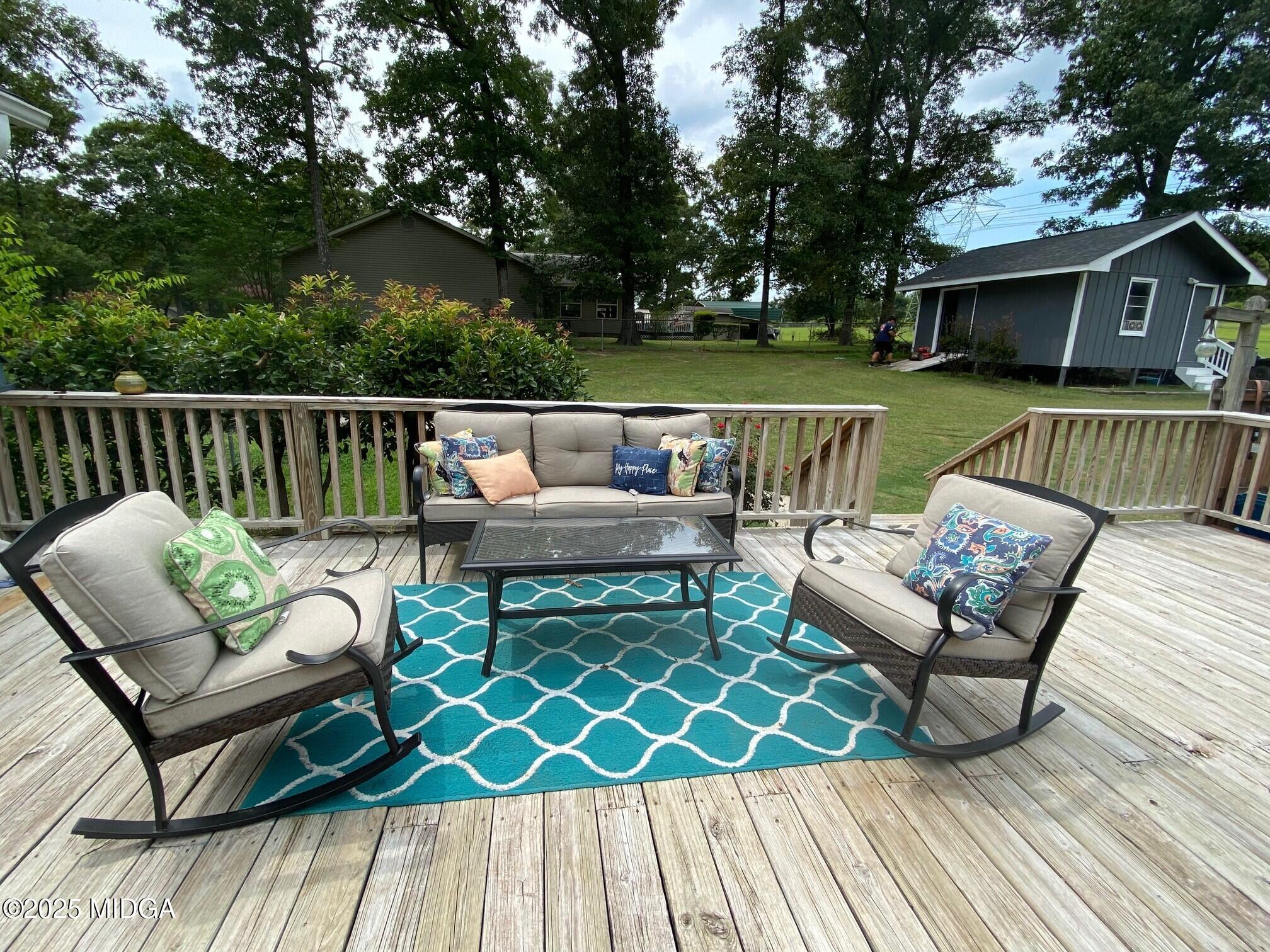 132 Old Hickory Road Byron, GA 31008 - Photo 25 of 35 a view of a house with wooden deck and furniture