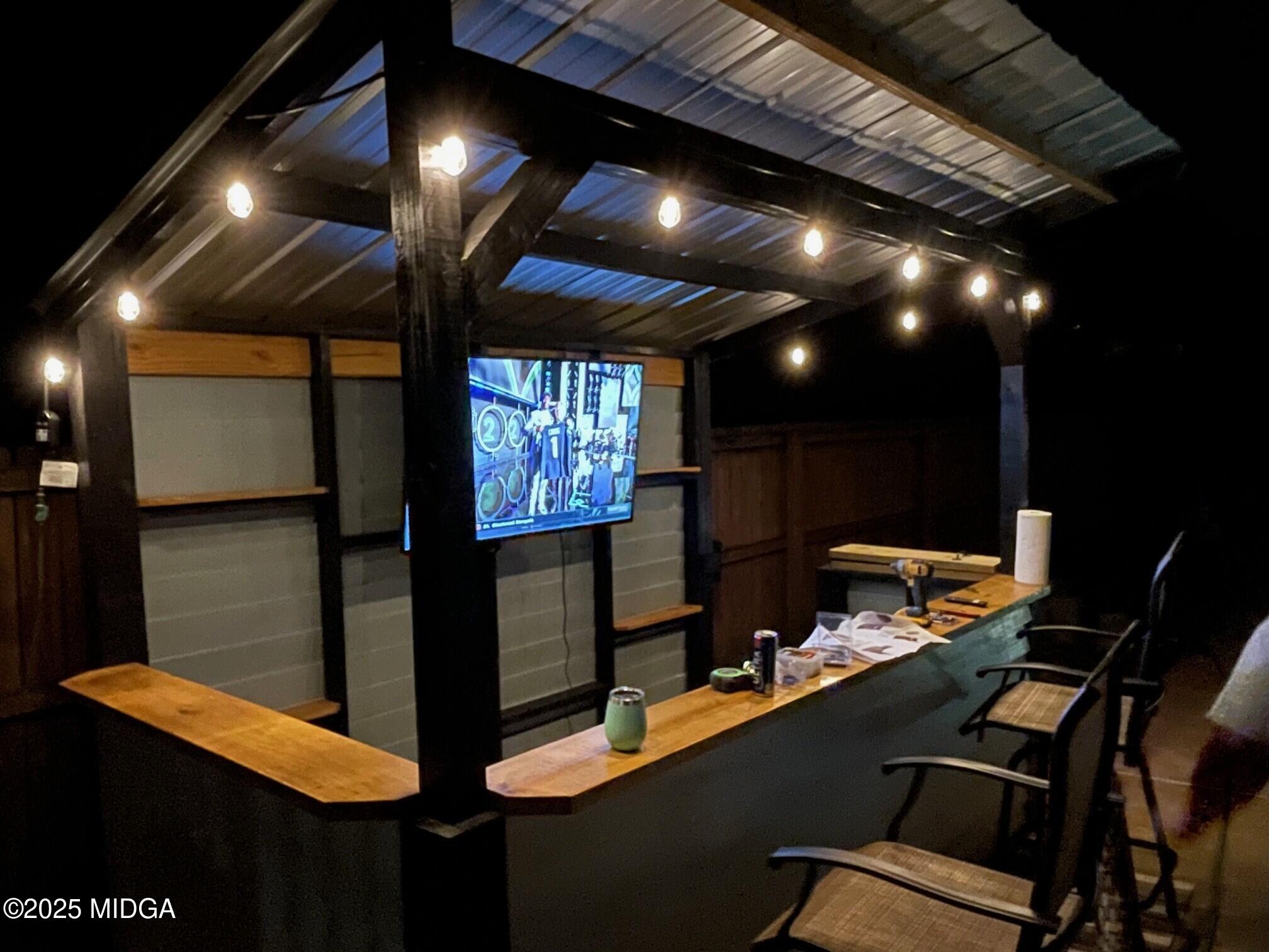 132 Old Hickory Road Byron, GA 31008 - Photo 32 of 35 a projector room with furniture and screen