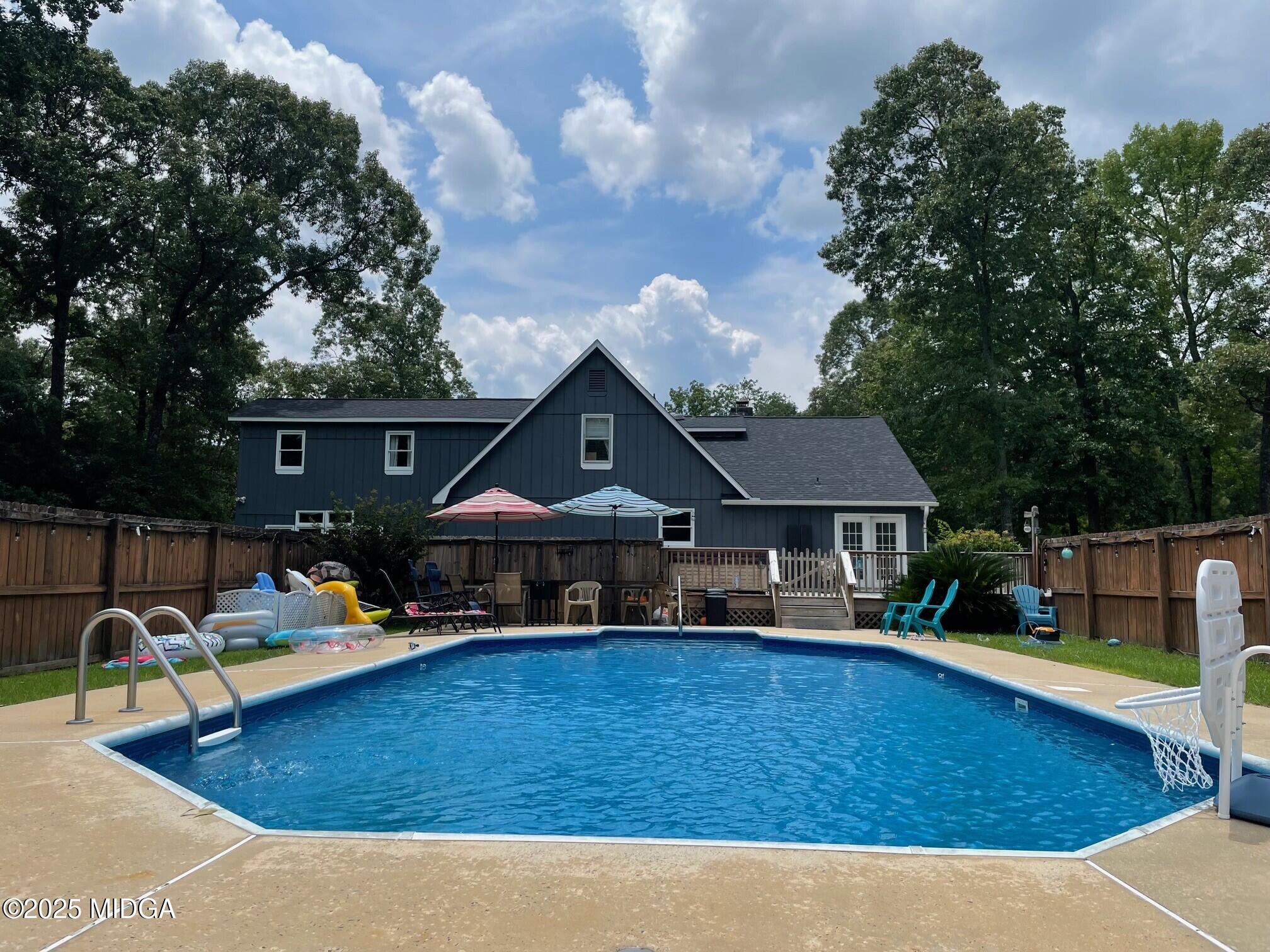 132 Old Hickory Road Byron, GA 31008 - Photo 34 of 35 a view of a house with swimming pool and sitting area