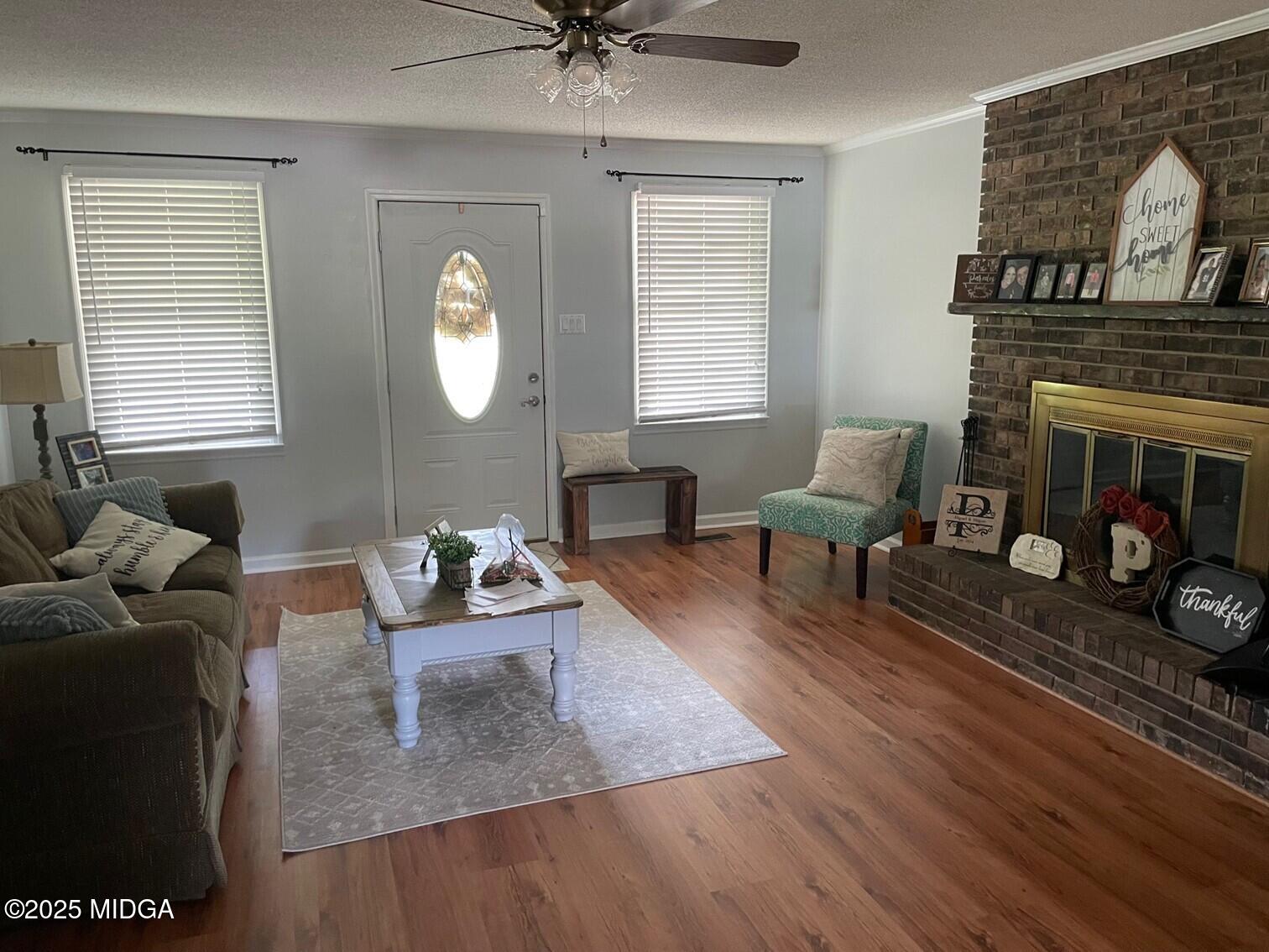 132 Old Hickory Road Byron, GA 31008 - Photo 6 of 35 a living room with furniture and a fireplace