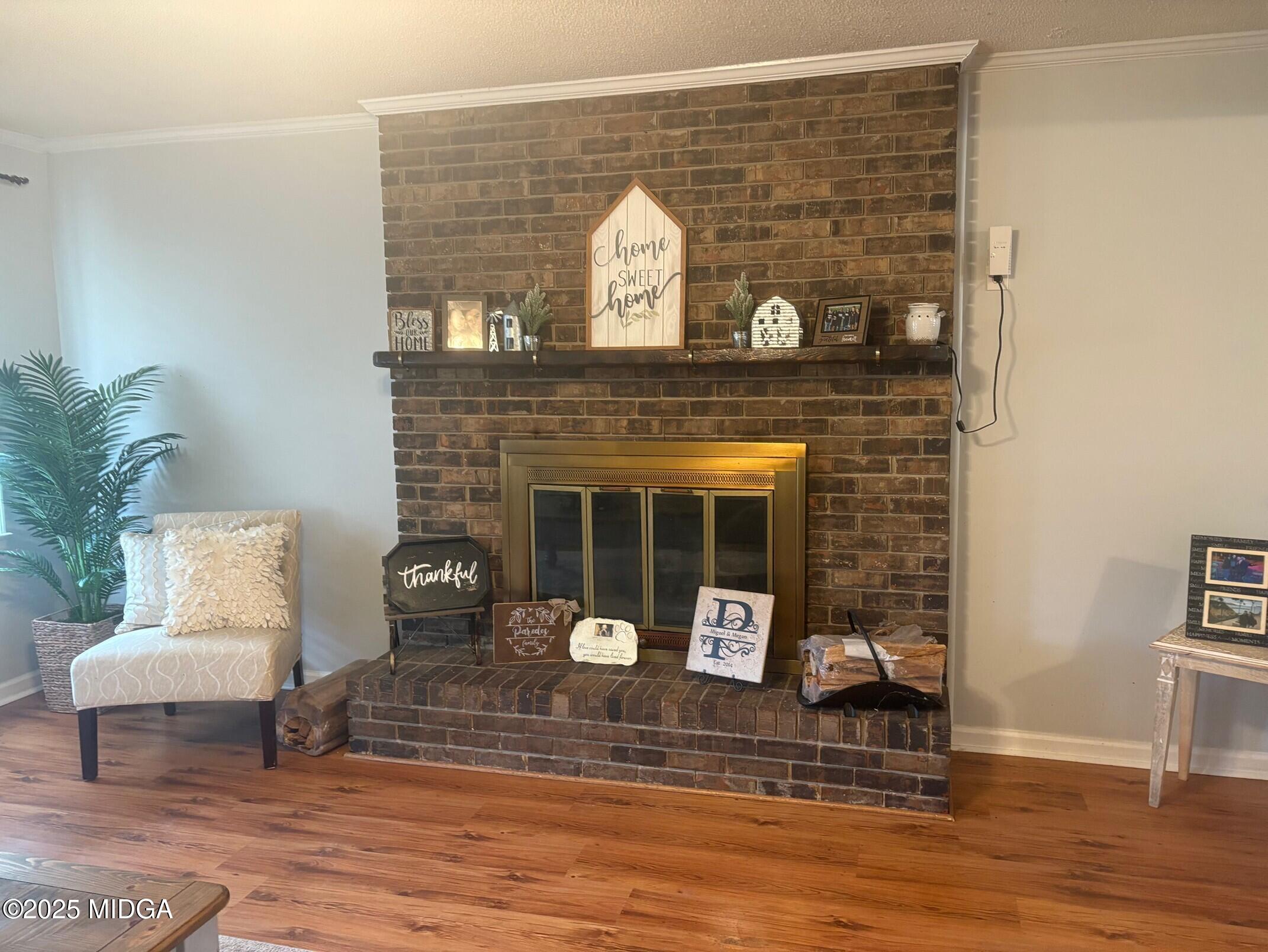 132 Old Hickory Road Byron, GA 31008 - Photo 7 of 35 a living room with furniture and a fireplace