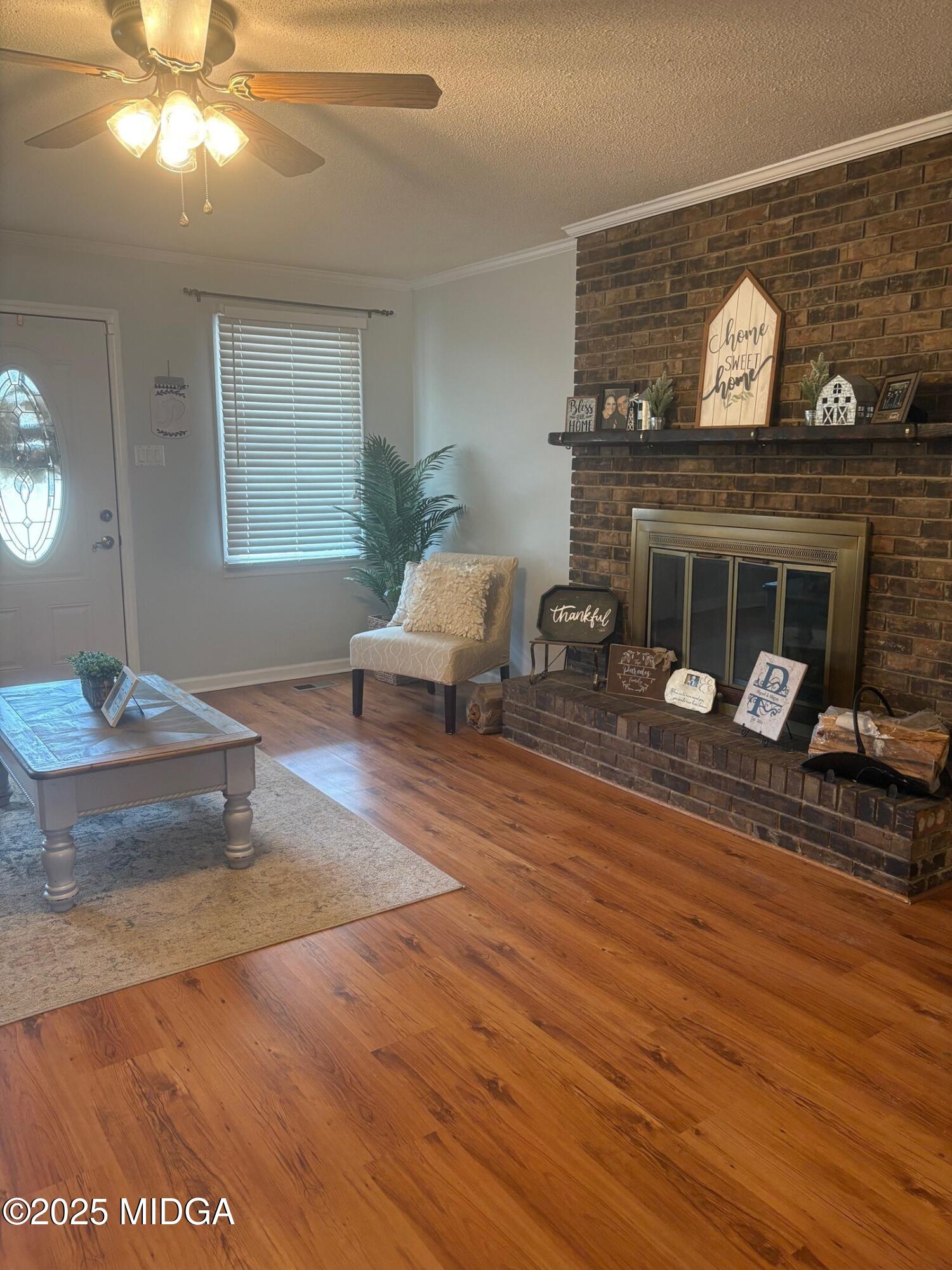 132 Old Hickory Road Byron, GA 31008 - Photo 8 of 35 a living room with furniture and a fireplace