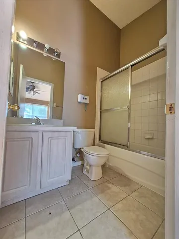 a bathroom with a toilet a sink and shower