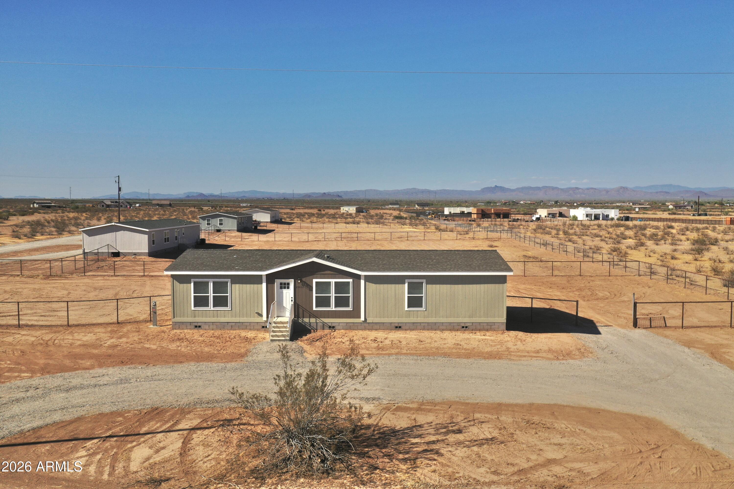 a front view of a house with a ocean view