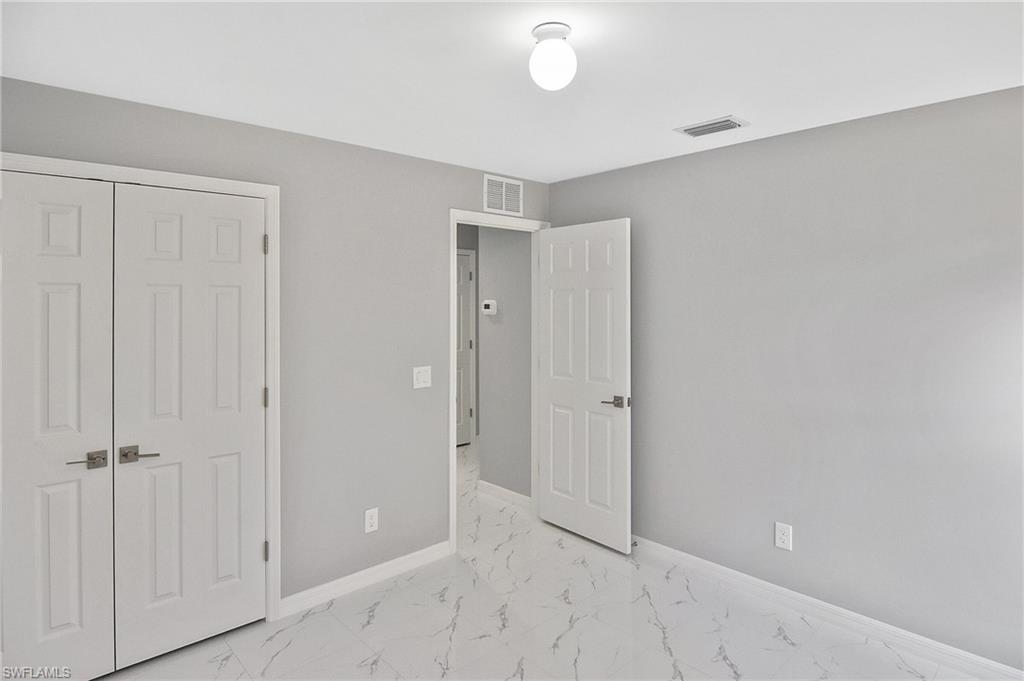 3306 1st Street Southwest Lehigh Acres, FL 33976 - Photo 14 of 47 a view of an empty room