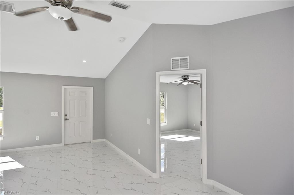 3306 1st Street Southwest Lehigh Acres, FL 33976 - Photo 23 of 47 a view of a big room with windows and cabinet