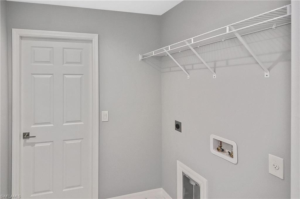 3306 1st Street Southwest Lehigh Acres, FL 33976 - Photo 10 of 47 a view of a hallway
